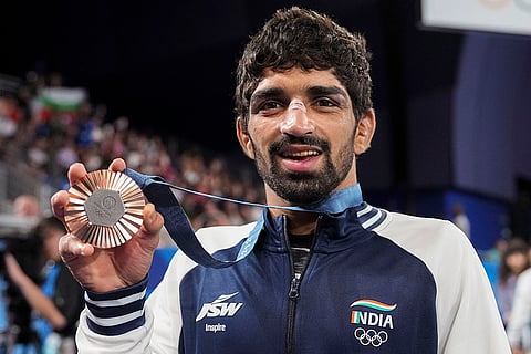Men's 57kg free-style wrestling: Aman Sehrawat poses for photos